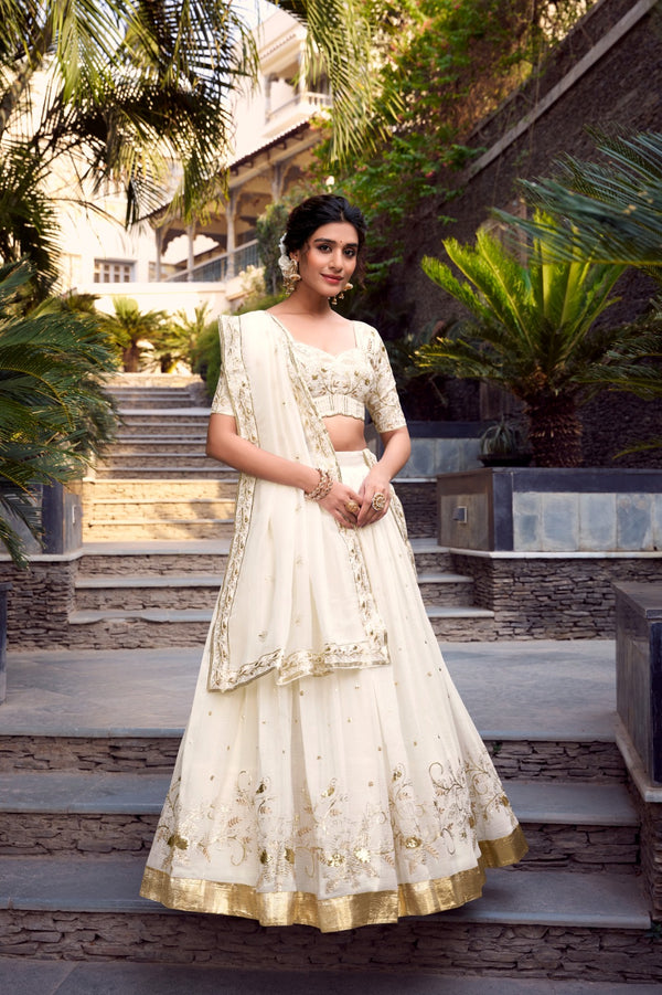 Off-white glam with intricate glossy dance Unstitched Lehengas
