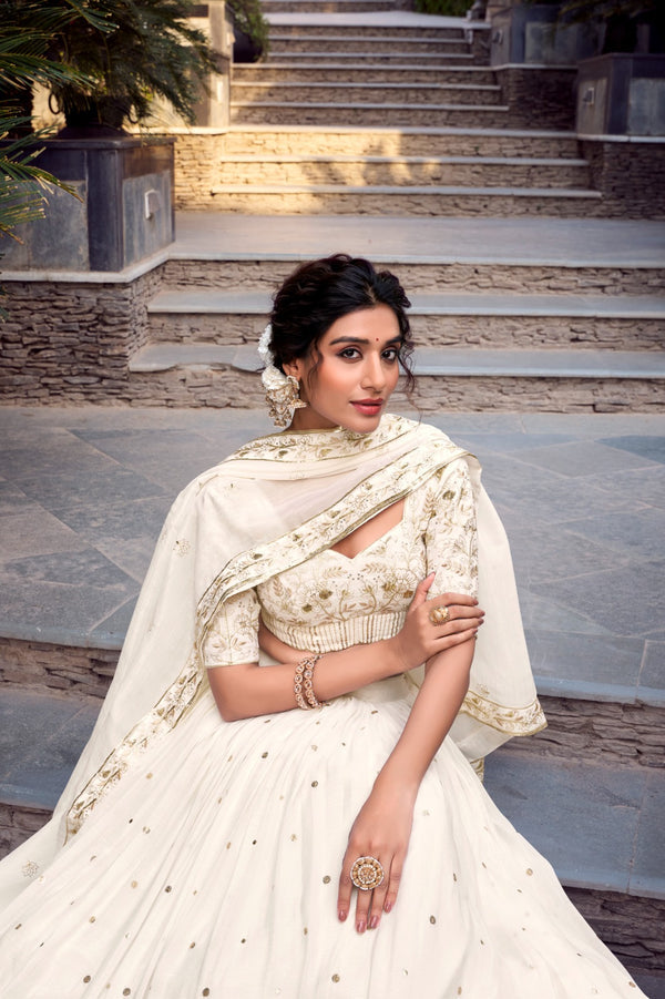 Off-white glam with intricate glossy dance Unstitched Lehengas