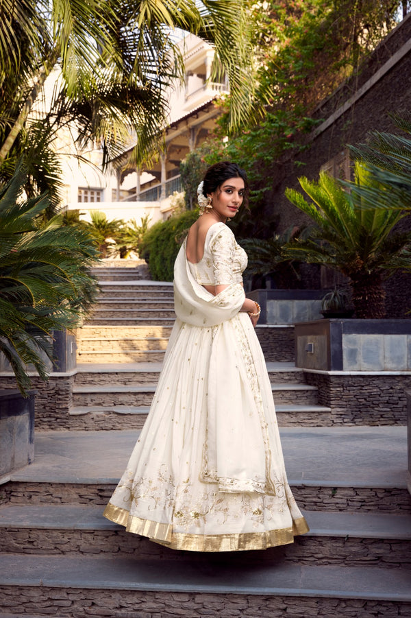 Off-white glam with intricate glossy dance Unstitched Lehengas